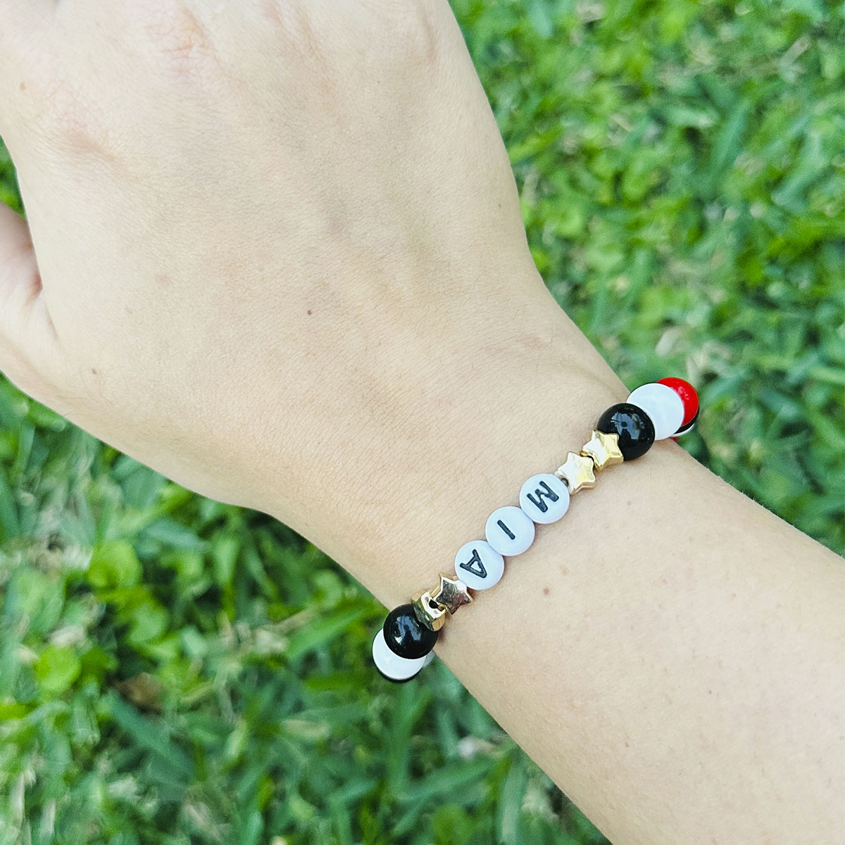 Pulsera Elástica Cuentas Mía Estrellas Doradas y Bronce