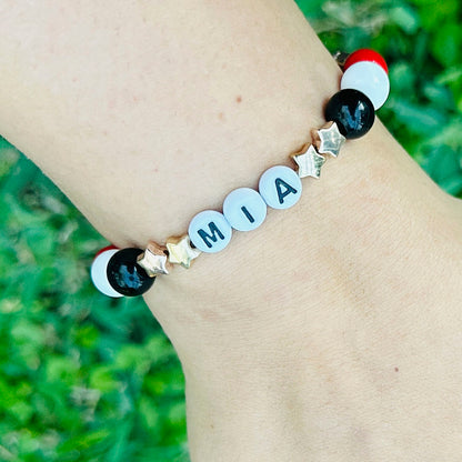 Pulsera Elástica Cuentas Mía Estrellas Doradas y Bronce